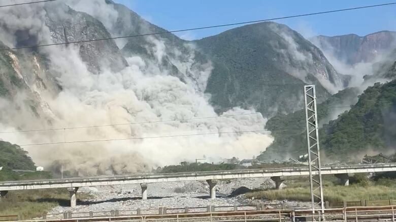 A view of a landslide on the side of a mountain following an earthquake.