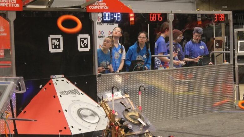 Members of the Amazon Warriors from the Windsor, Ont., area are shown competing in a robotics competition.