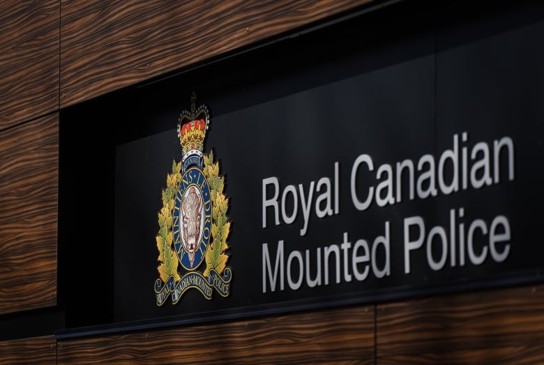 The RCMP logo is seen outside the force's 'E' division headquarters in Surrey, B.C., on Thursday, March 16, 2023. 