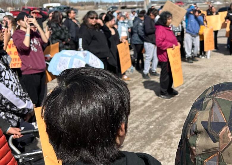 People holding signs