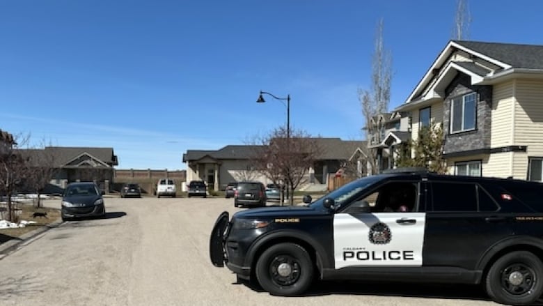 a police suv blocks off a residential street