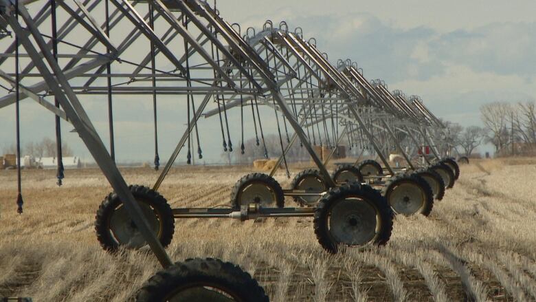 Farming equipment is pictured in a field.