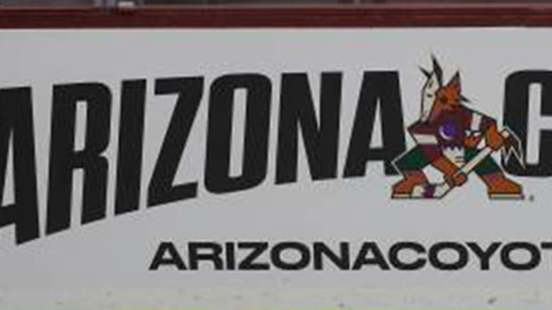 Arizona Coyotes name and logo on boards at Mullett Arena in Tempe.