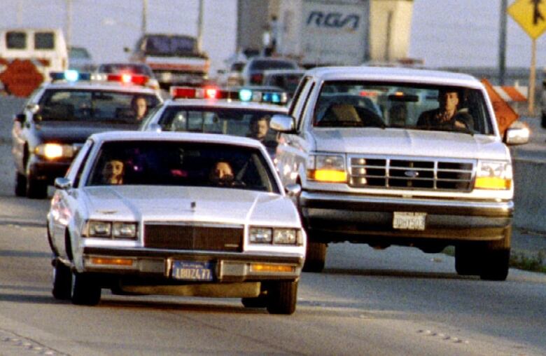 Three vehicles are shown from ground level on a roadway.