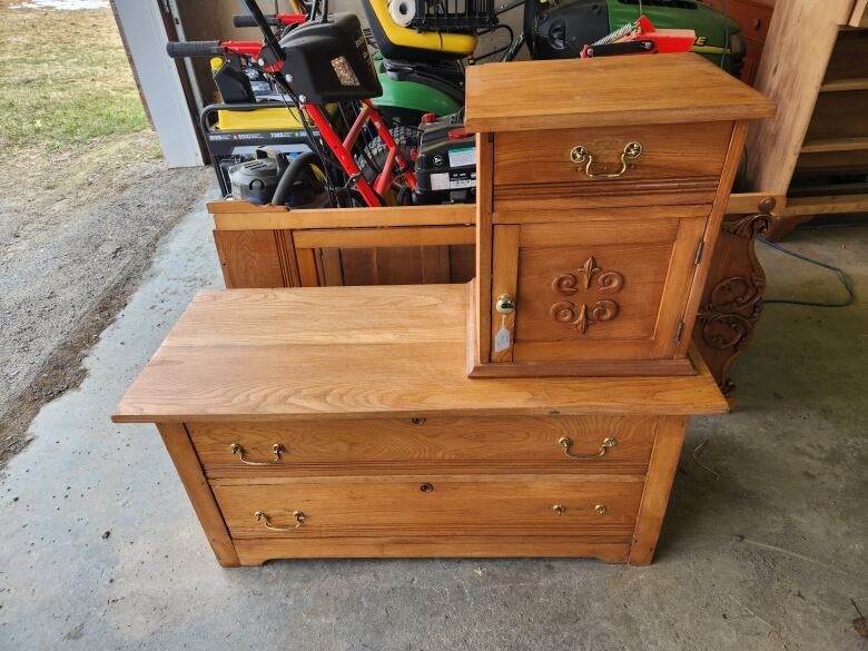 Old dresser sitting in a garage