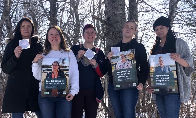 People holding some signs