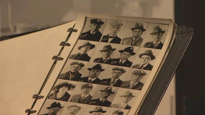 a photo of a book with many tiny historical portraits of people.