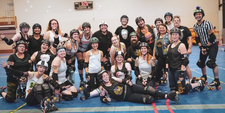 Saskatoon Roller Derby League members pose in a group photo at the House Team Showdown game in August, 2023.