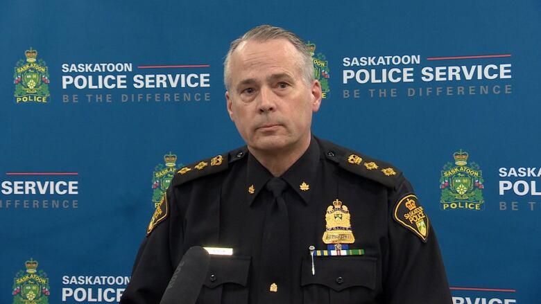 A police officer talks at a podium.