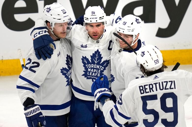 Toronto Maple Leafs center John Tavares (91) is congratulated after his goal against Boston Bruins goaltender Linus Ullmark (not shown) during the second period of Game 2 of an NHL hockey Stanley Cup first-round playoff series, Monday, April 22, 2024, in Boston. (AP Photo/Charles Krupa)