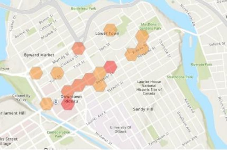 A map of a city's downtown with red and orange dots mapping higher-crime areas.