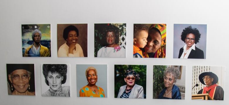 Photos of 11 women are displayed on a white wall.