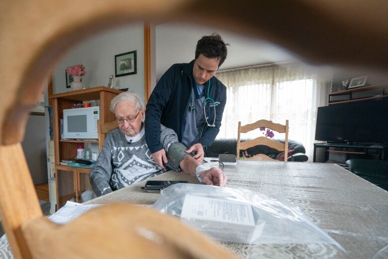 Nurse checks patient's vitals