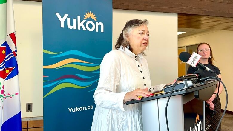 Woman standing at a podium