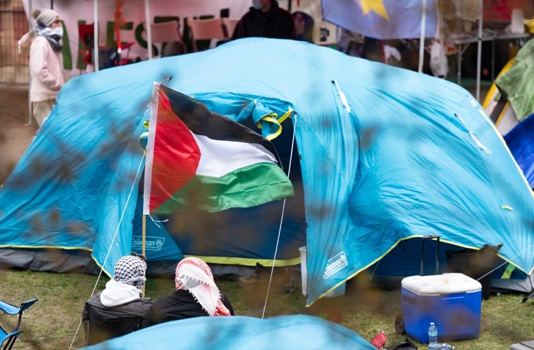 blue tent with flag in front