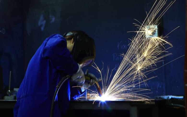 Kait Herron from Palmerston North gets hands on experience using a welder at the Woodbourne Airbase 