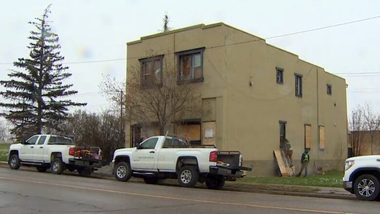 A building stands on the side of the road. 