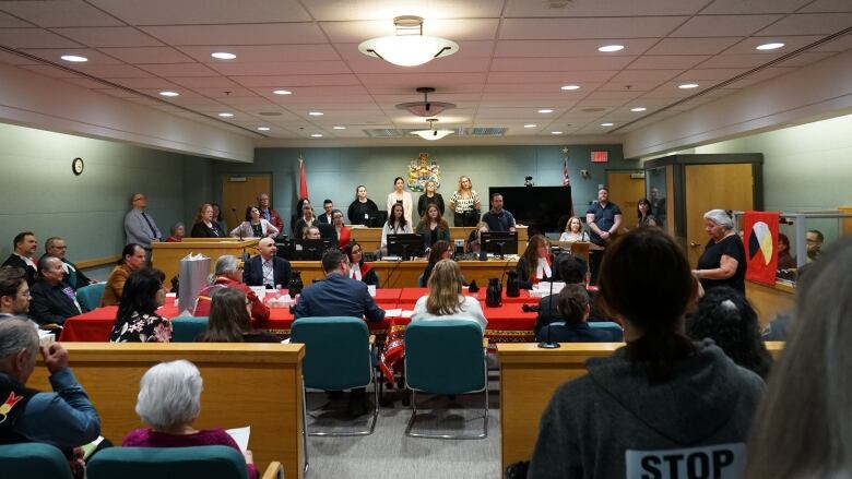 People sitting in a courtroom.