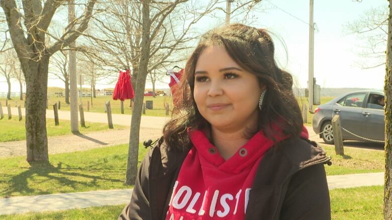 Woman standing in park.