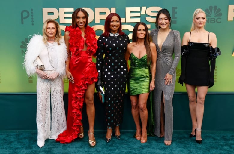 The cast of Real Housewives of Beverly Hills (L-R) Kathy Hilton, Annemarie Wiley, Garcelle Beauvais, Kyle Richards, Crystal Kung Minkoff and Erika Jayne arrive for the 2024 People's Choice awards at the Barker Hangar in Santa Monica, California, February 18, 2024.  