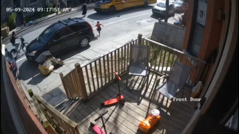 This screengrab from a video shared on social media by Mayer Feig shows the moment the young girl crosses the street as the cyclist is approaching.