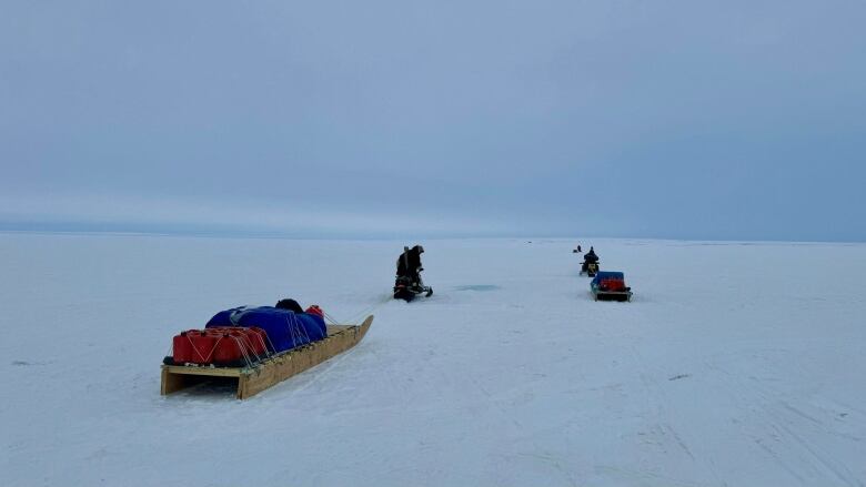 Snowmobiles and sleds near Cambridge Bay, Nu. 