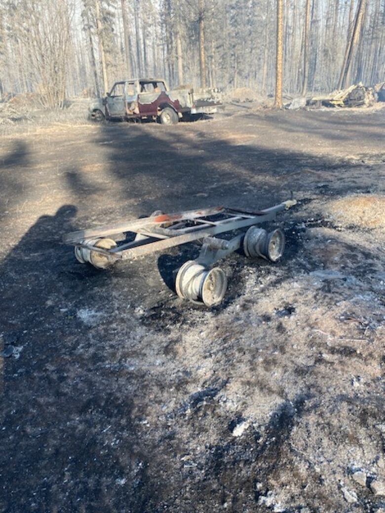 Burnt remains of vehicles.