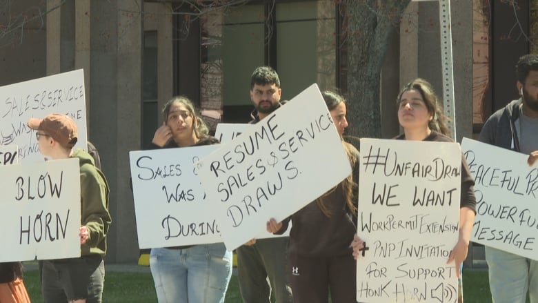 People with signs of protest.