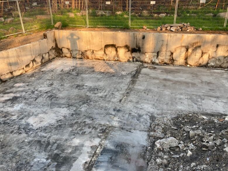 Burn marks around the foundation of a home is shown in a photo taken after the Upper Tantallon and Hammonds Plains wildfire.