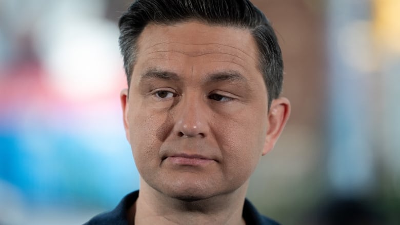 Conservative Leader Pierre Poilievre listens to media questions during a news conference on safety in hospitals in Vancouver, on Tuesday, May 14, 2024.