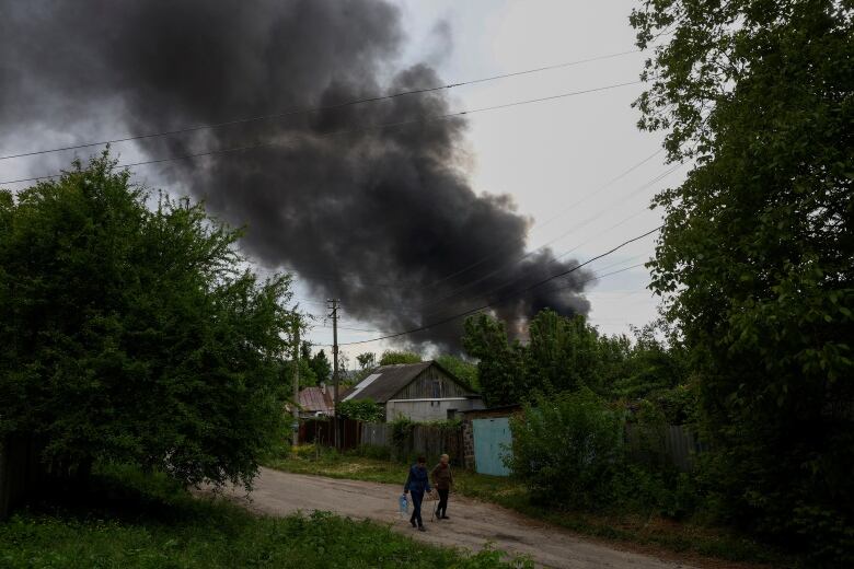 A large column of smoke is seen rising in Kharkiv, Ukraine, in the aftermath of a Russian missile strike on Friday, May 17, 2024.