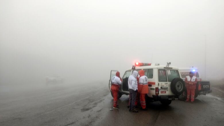 Rescues stand in fog