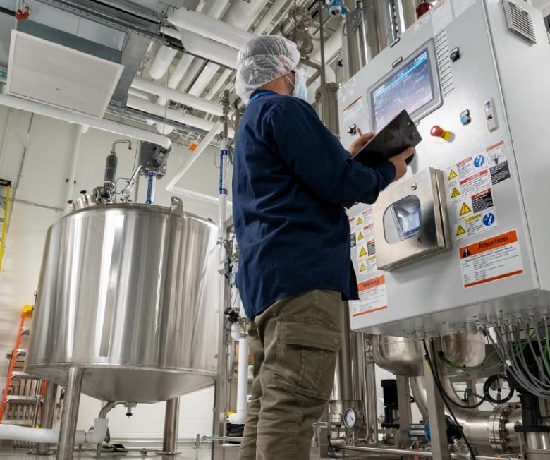 A technician is seen working at the Biologics Manufacturing Centre in Montreal.