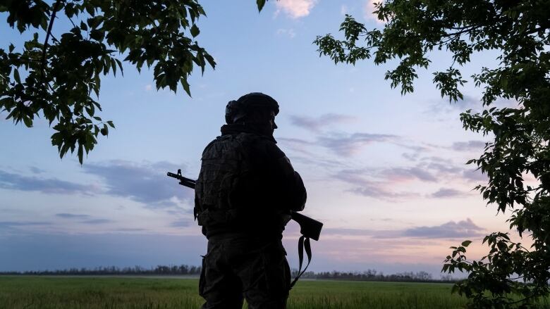 A Ukrainian soldier guards an area near the town of Vovchansk, in Ukraine's Kharkiv region near the Russian border.