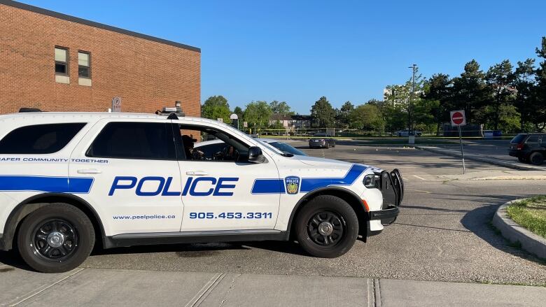 Peel police at the scene of a double shooting in the parking lot of a Mississauga public school.