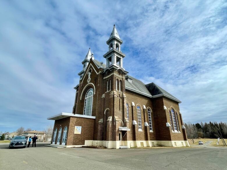 Brick church with silver steeples