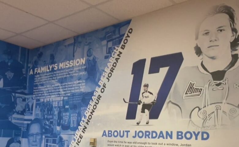 a mural dedicated to Jordan Boyd. The number 17 is in large font next to his portrait. There is small text about the families mission to remember Jordan. 