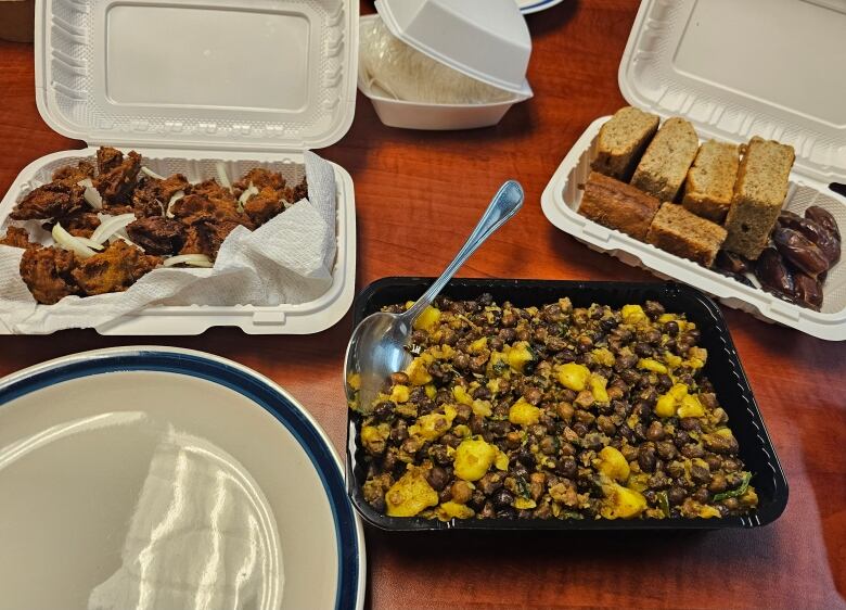 Plastic containers contain a variety of dishes.