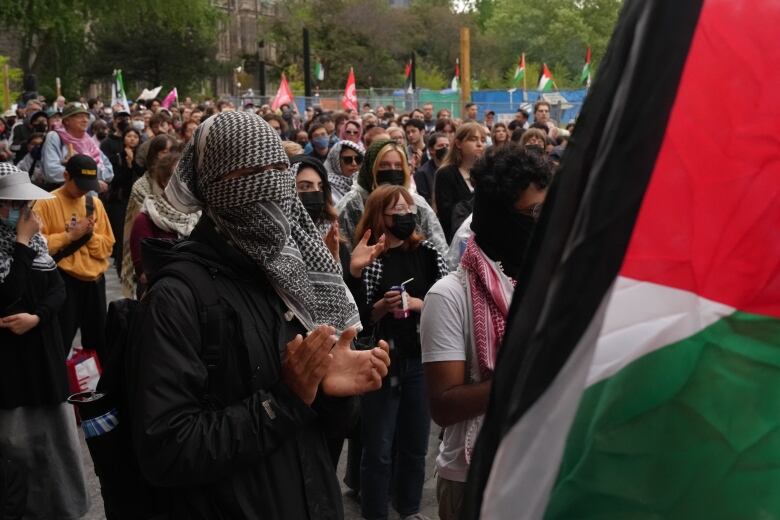 People attend a pro-Palestinian rally outside Convocation Hall on the University of Toronto campus on May 27, 2024.