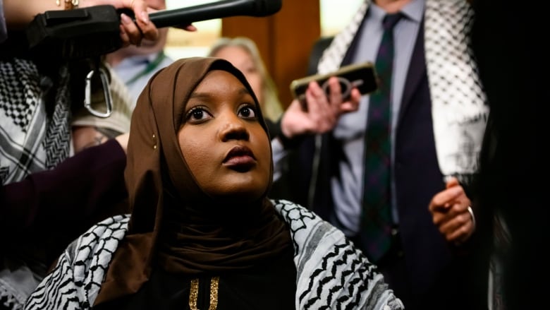 Woman wearing keffiyeh