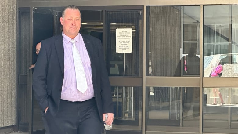 Former Woodstock mayor Trevor Birtch leaves court on Thursday, May 30. 