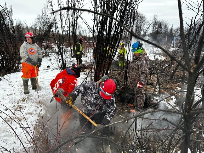 Firefighters fight a fire.