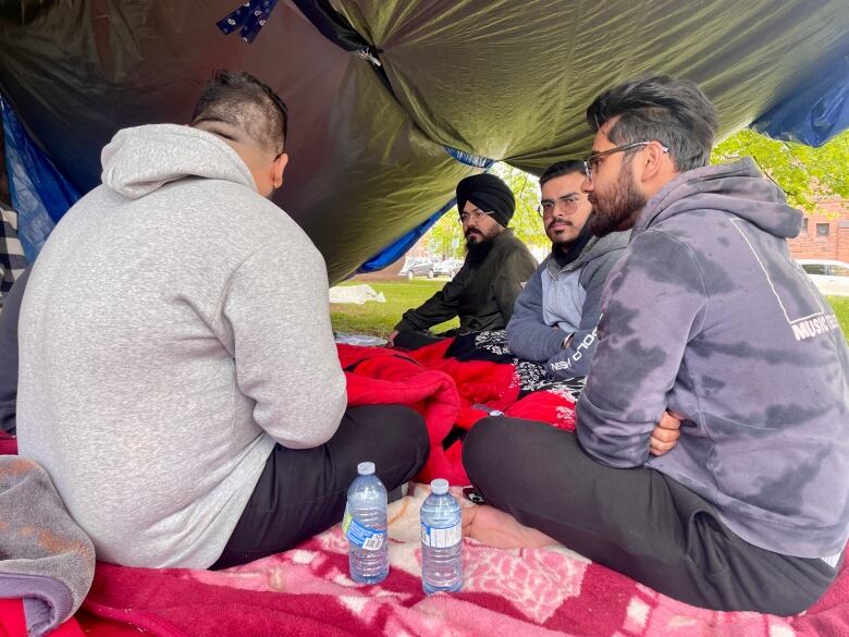 Protesters in front of the Coles Building were drinking water and felt more optimistic after getting to speak with government officials on Friday.