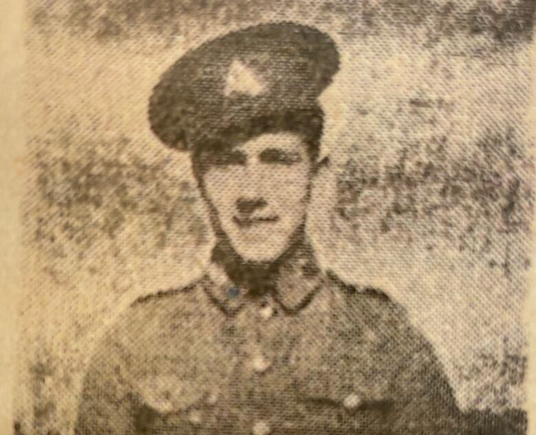 Black and white photo of Francis Trainor, in uniform, from newspaper clipping.