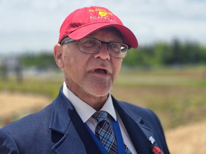 A man in a red cap.