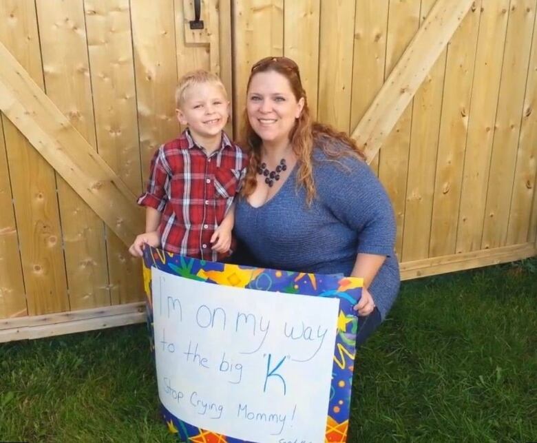 Evan Meunier and his mother