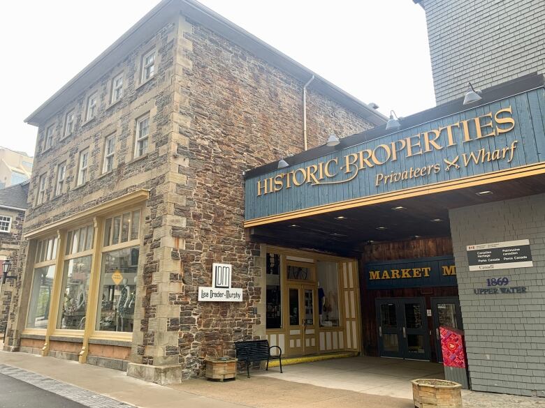 A sign is shown on a wall at Historic Properties in Halifax.