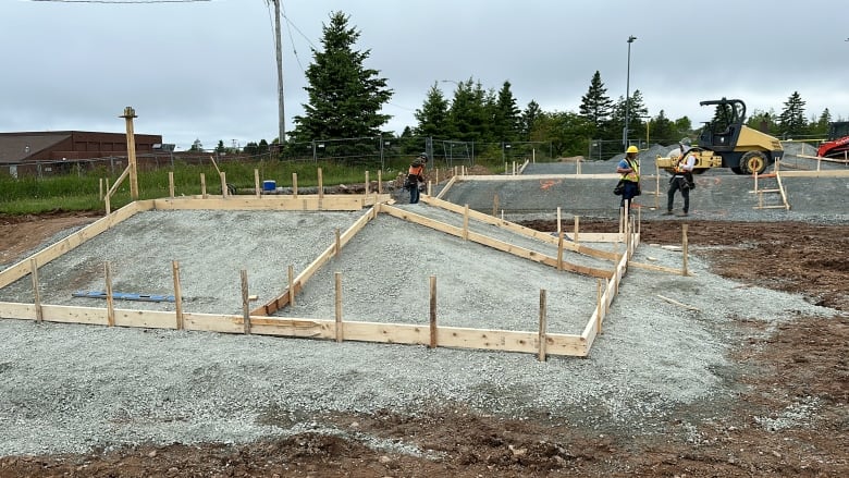 Wooden forms are shown in gravel slopes that will be filled with concrete for the Eastern Passage Common Skate Park.