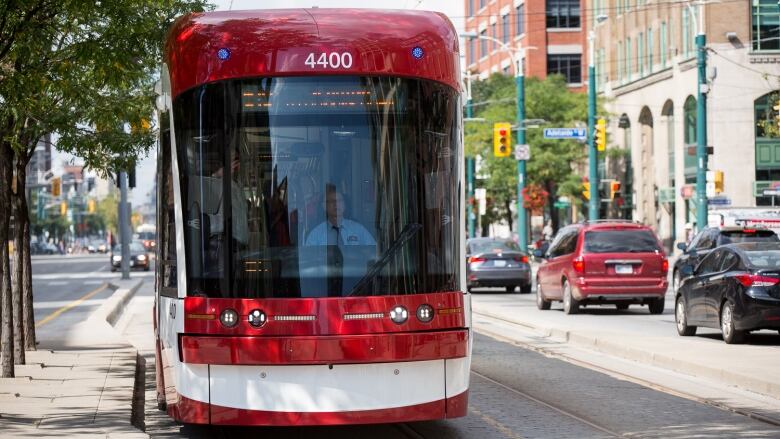 A streetcar on a sunny day in downtown Toronto.