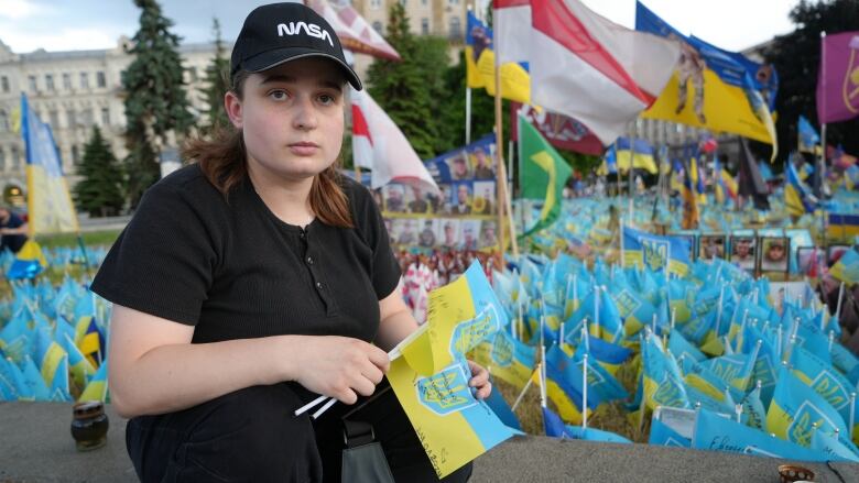 Kateryna Fodorova went to Kyiv's Maidan Square on June 11 to leave flags in memory of her brother and cousin who were killed fighting in eastern Ukraine. 